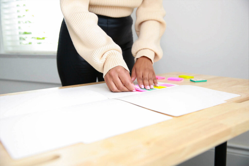A woman using post-its to get organized