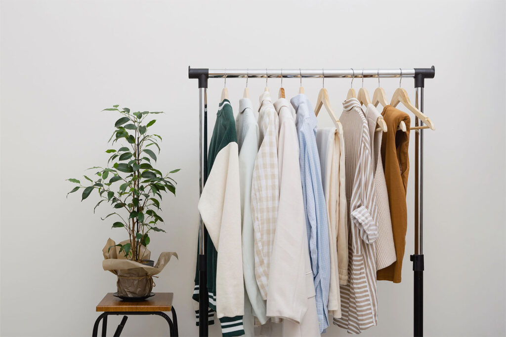 A few key pieces of clothing on a rack.