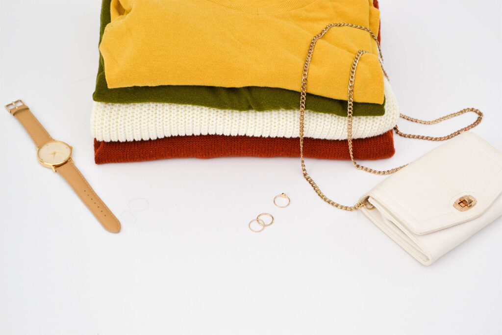 A few tops folded with accessories