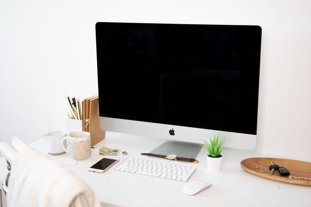 Computer on a Desk in a White Office