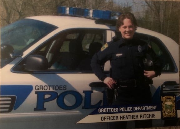 Heather as a police officer