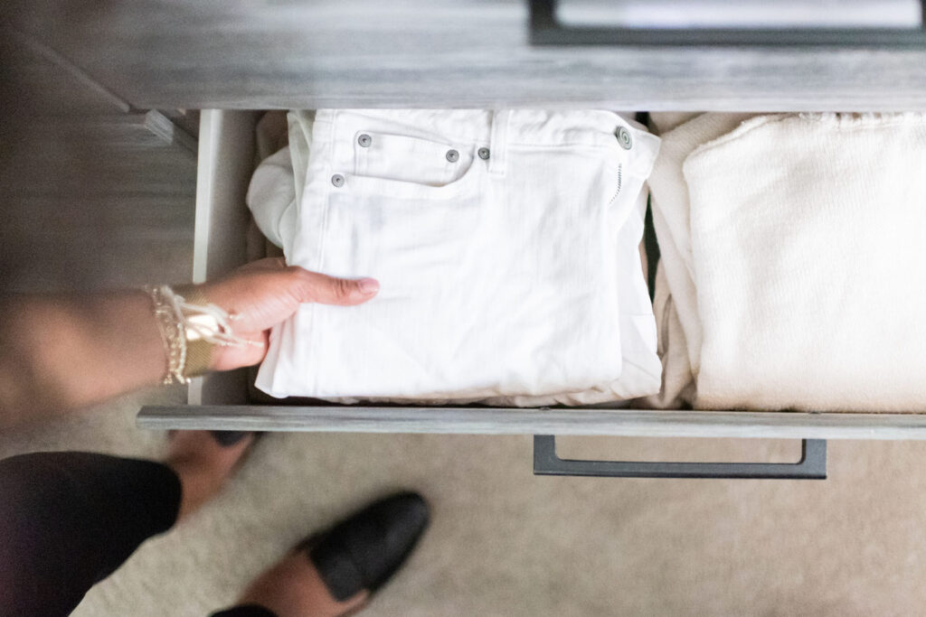 organizing clothing into drawers