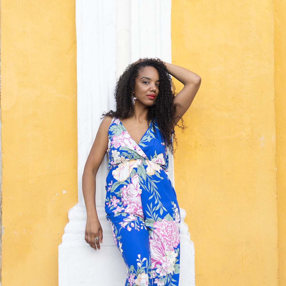 Nadalie It's All You Boo in front of yellow wall.